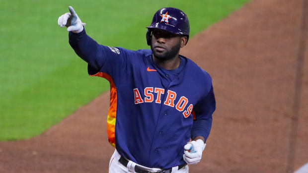 Astros left fielder Yordan Alvarez reacts after hitting a three-run homer in Game 6 of the World Series